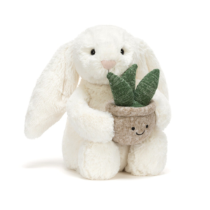Peluche lapin Jellycat Cream Bunny avec plante décorative